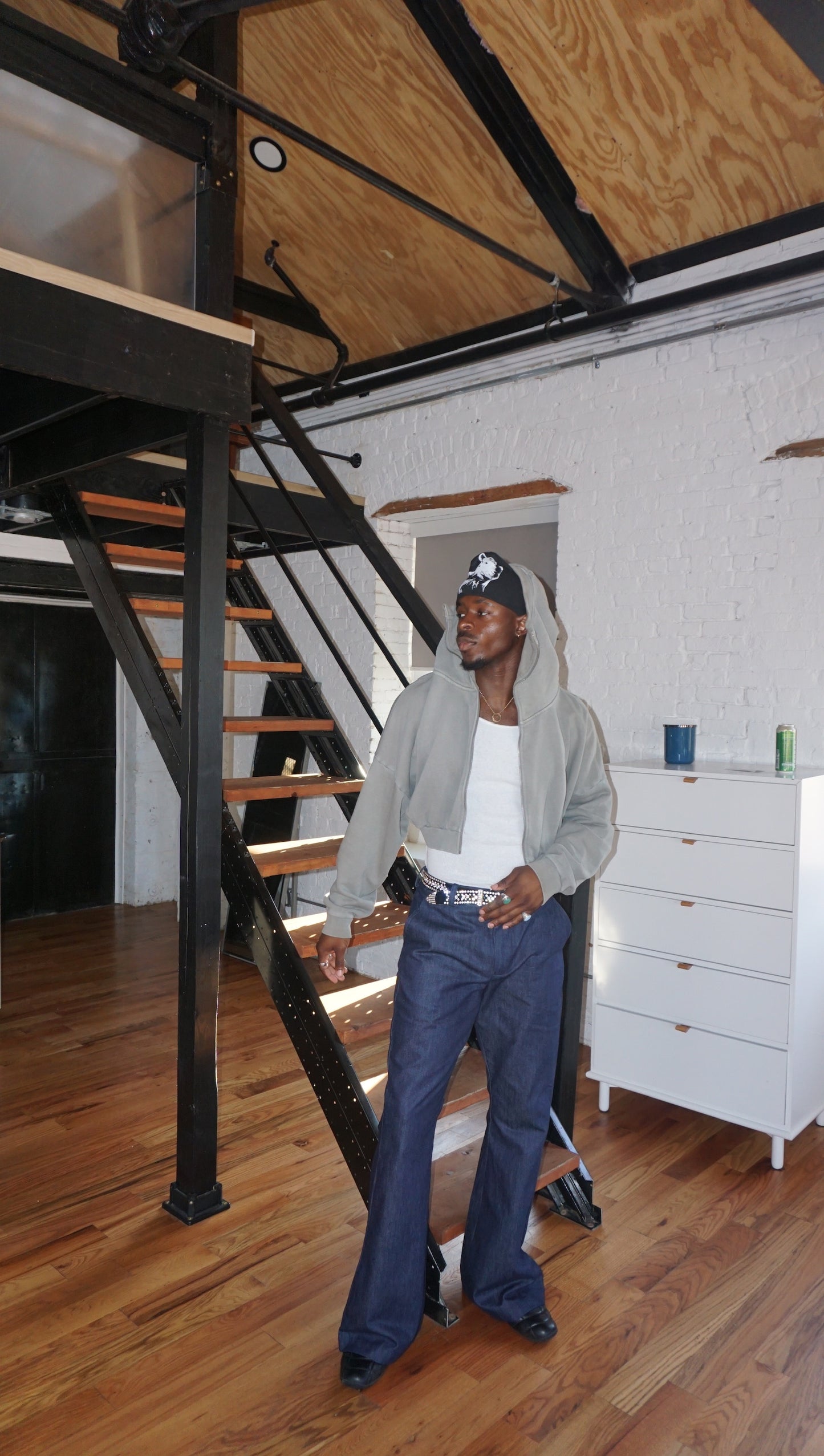 Man wearing blue denim flare pants with vintage bell bottom silhouette