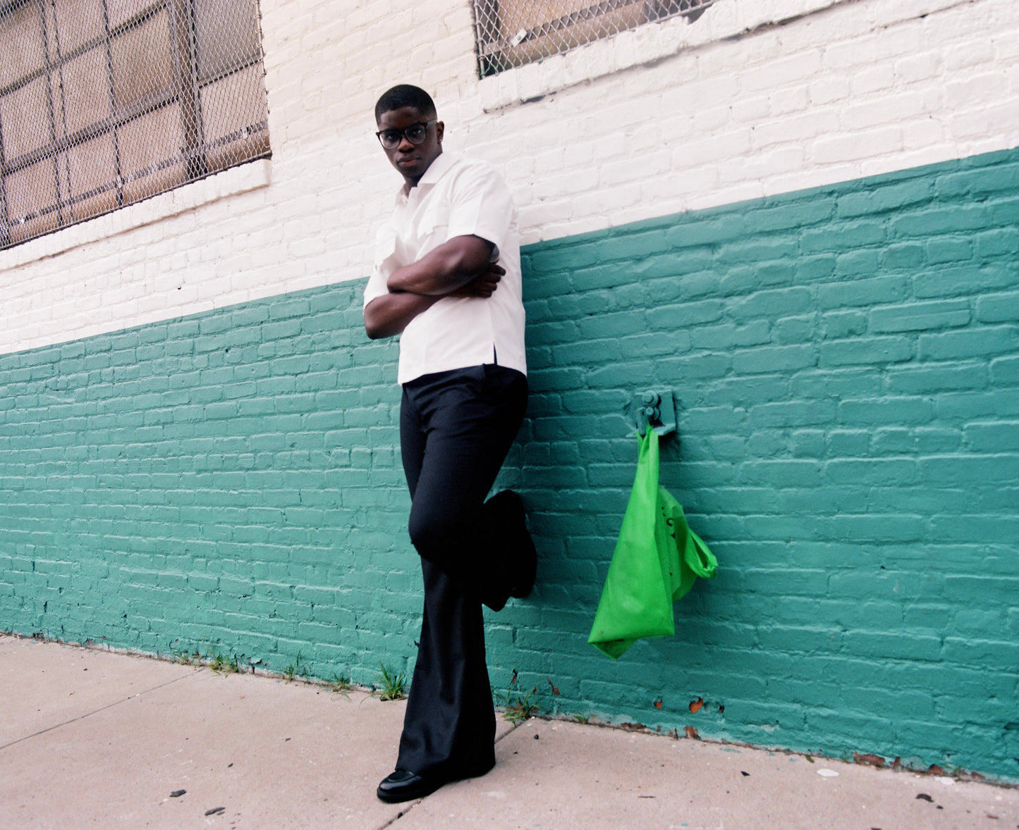 Men wearing black flare pants with vintage 70s bell bottom silhouette