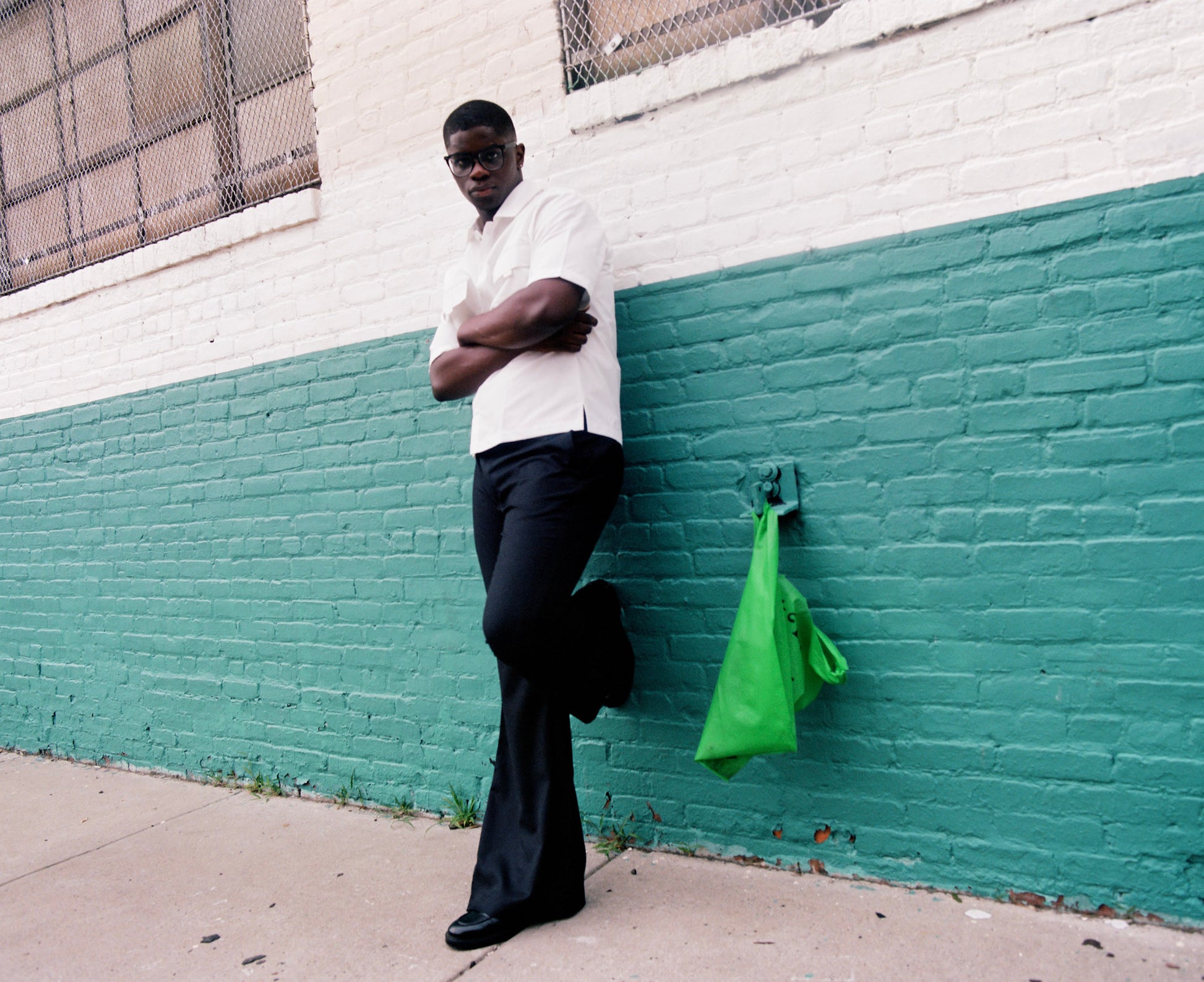 Men wearing black flare pants with vintage 70s bell bottom silhouette